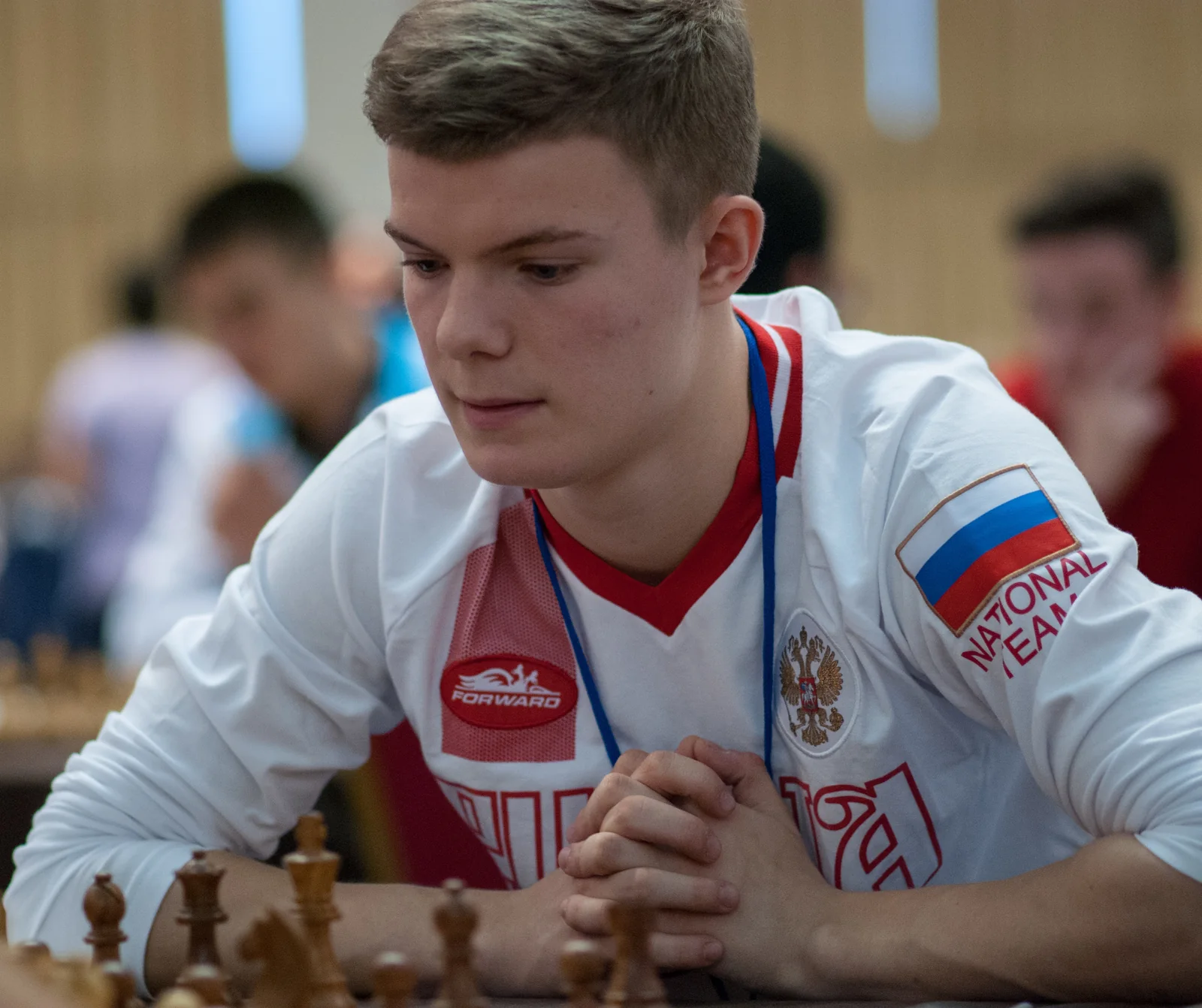 Grandmaster Kirill Alekseenko seated at the chess board